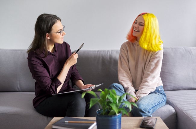 social worker chatting with teen girl
