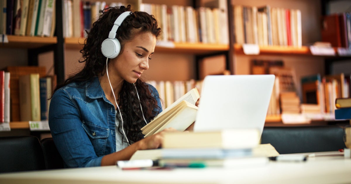 woman studying in library