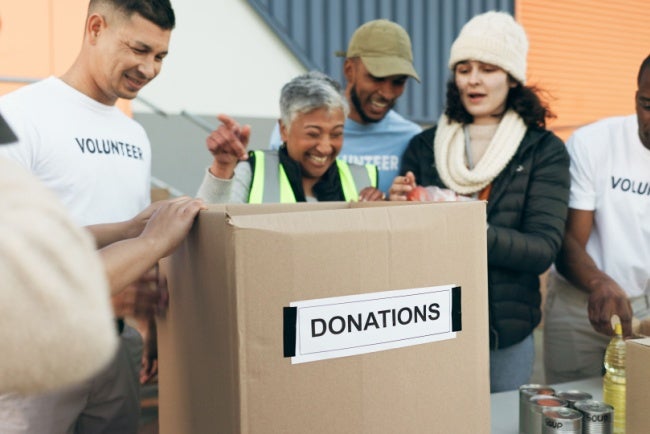group of social workers around donations box